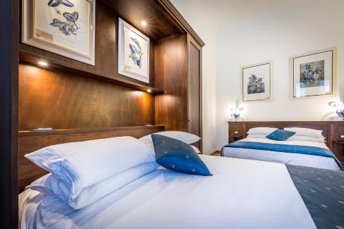 Postel nebo postele na pokoji v ubytování HomEdo B&B