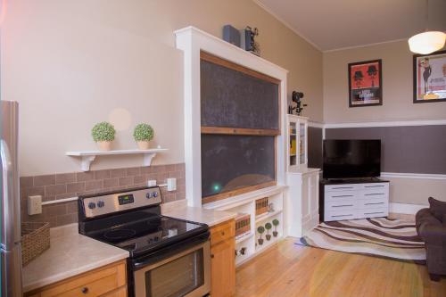 a kitchen with a blackboard in a room at School 31 Lofts in Rochester