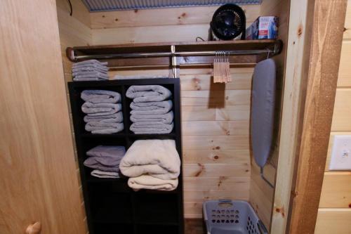 a towel rack with towels on it in a bathroom at The Cayo Cabin, Millersburg Ohio in Millersburg