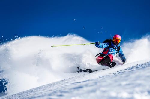 a person is skiing down a snow covered slope at Apart Andrea in Längenfeld