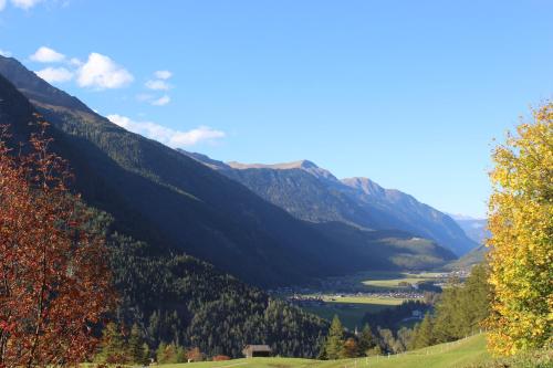 a view of a valley with a lake and mountains at Apart Andrea in Längenfeld