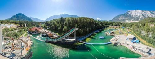 an amusement park with a slide in the water at Apart Waldblick in Oetz