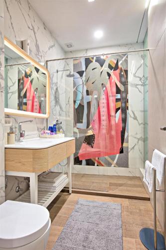 a bathroom with a toilet and a sink at FERHADIJA Apartments by Nejra in Sarajevo
