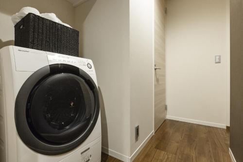 a washing machine with a basket on top of it at Kyo no yado en in Kyoto