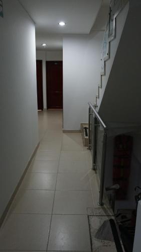 a hallway with a staircase in a house at Hotel Sipa in Duitama