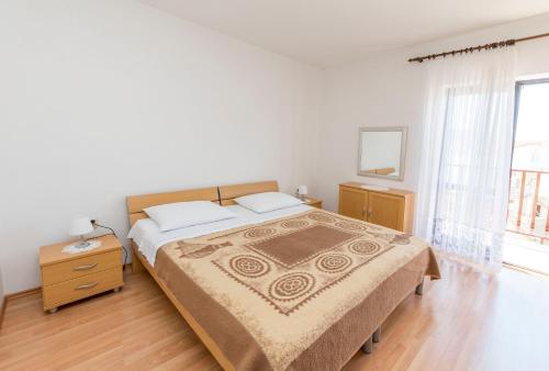Postel nebo postele na pokoji v ubytování Apartments Matejka