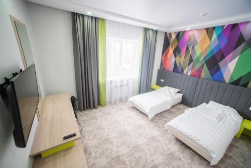 Postel nebo postele na pokoji v ubytování Aсe Hotel