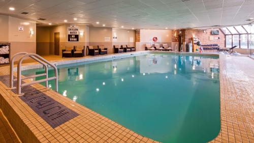 a large swimming pool in a hotel room at Best Western Plus Waterfront Hotel in Windsor
