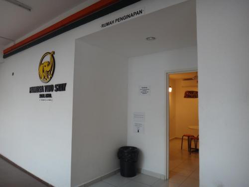 a wall in a building with a sign on it at Famosa 2 Stay in Melaka
