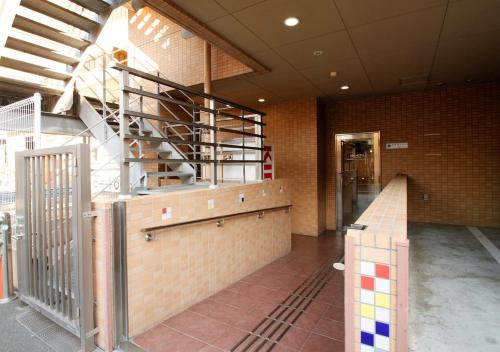 a room with a staircase in a building at APA Hotel Kagoshima Chuo Ekimae in Kagoshima