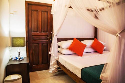 Ένα ή περισσότερα κρεβάτια σε δωμάτιο στο Beach Villa Randiya