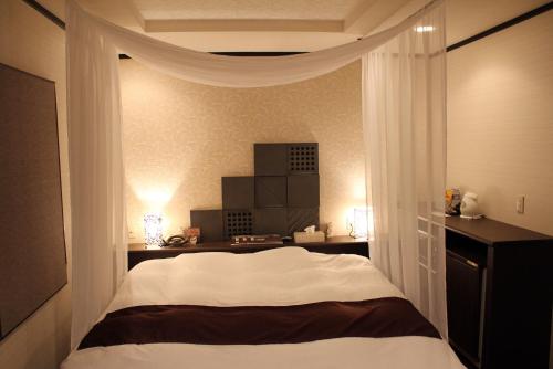 Postel nebo postele na pokoji v ubytování Hida Takayama Hotel Viera Resort (Adult Only)