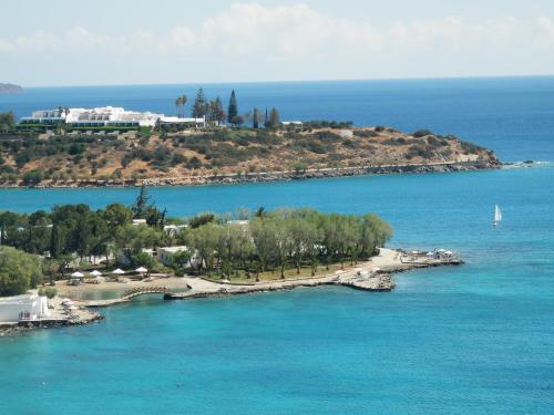 an island in the middle of a body of water at Eleni Studios in Agios Nikolaos