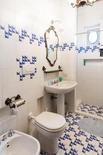 a bathroom with a white toilet and a sink at Agriturismo Il Poderaccio in Scandicci