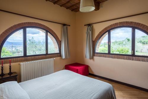 Postel nebo postele na pokoji v ubytování Agriturismo Il Poderaccio