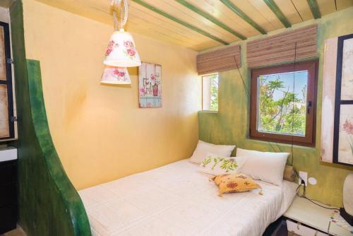 Ένα ή περισσότερα κρεβάτια σε δωμάτιο στο The Old Pomegranate House