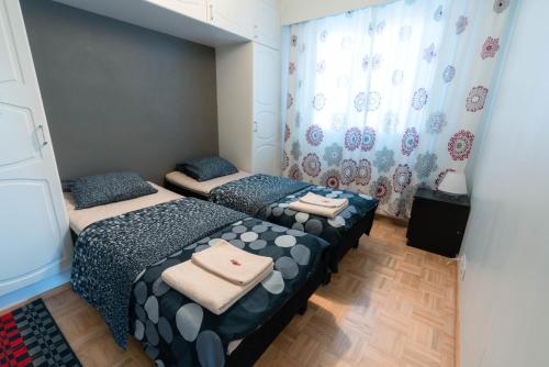 Giường trong phòng chung tại Oulu Hotelli Apartments