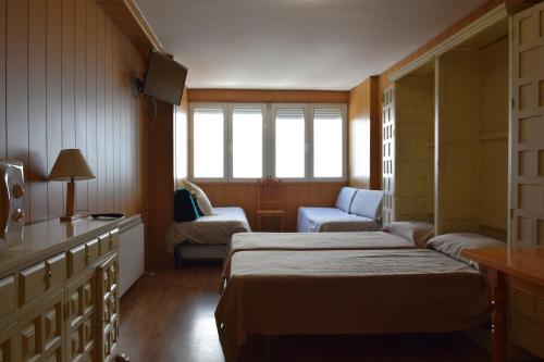 Кровать или кровати в номере Sol del Sur Sierra Nevada