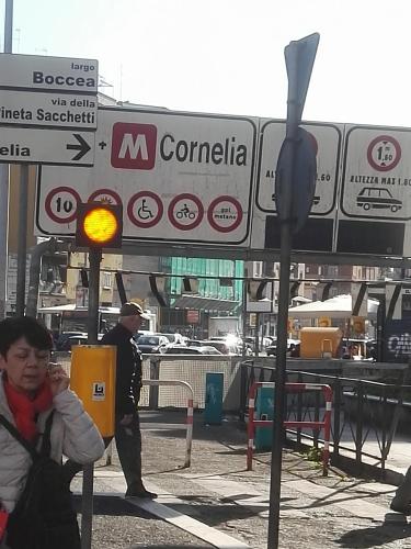 a police officer standing next to a street sign at B&B Destinazione Roma in Rome