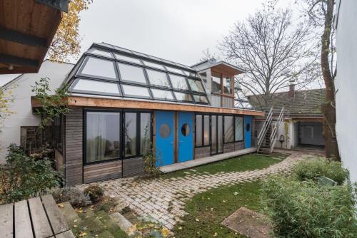a house with a blue door and windows at Apartments near metro station in Vienna