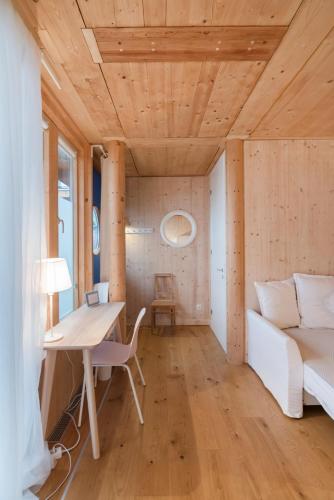 a living room with a white couch and a table at Apartments near metro station in Vienna