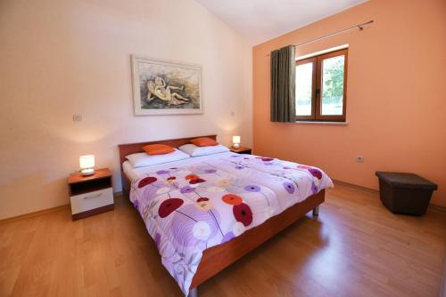 Postel nebo postele na pokoji v ubytování Villa Kmacici 377