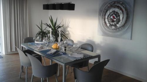 a dining room with a table and chairs at Penthouse Poseidon in Blankenberge