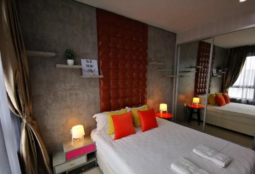 Ένα ή περισσότερα κρεβάτια σε δωμάτιο στο Host Assist Homestay by HA i-City