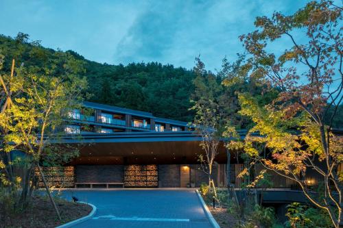a house in the middle of a forest at Fufu Kawaguchiko in Fujikawaguchiko