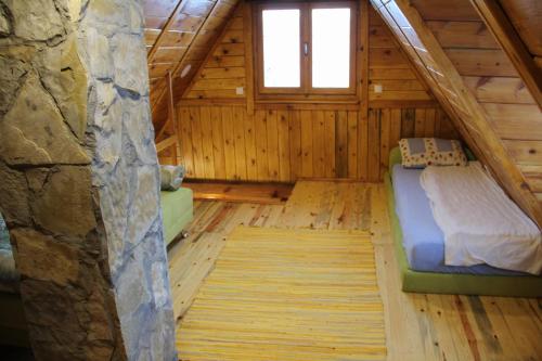 A bed or beds in a room at Vila Zlatibor Tornik