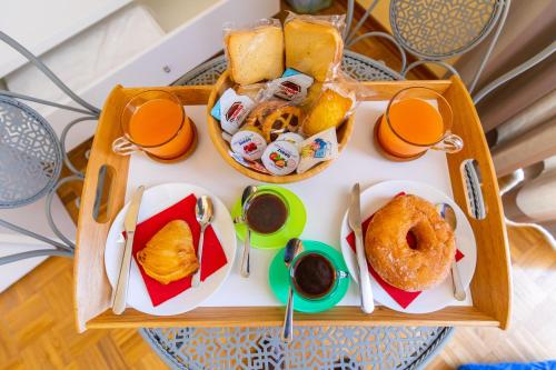 a tray of breakfast food on a table at B&B Trianon in Naples