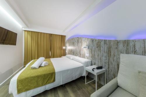 Ένα ή περισσότερα κρεβάτια σε δωμάτιο στο Welikehotel Triton Beach