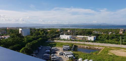 an aerial view of a parking lot with cars parked at Mactan Newtown Ocean View 360 Degree in Mactan