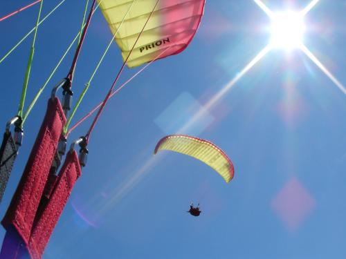 a paraglider is flying in the sky at Apartment Lilly in Lienz