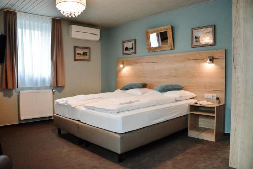 
Postel nebo postele na pokoji v ubytování Hotel U Hradu
