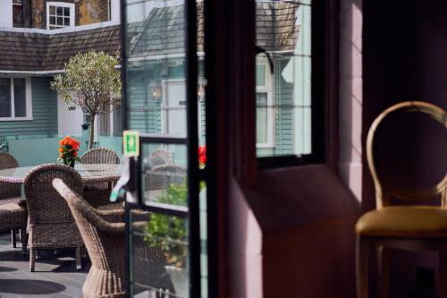a view of a table and chairs outside a door at Hotel Du Vin & Bistro Brighton in Brighton & Hove