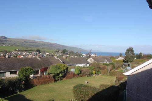 a group of houses in a suburb with mountains in the background at Cairnview Bed and Breakfast in Larne