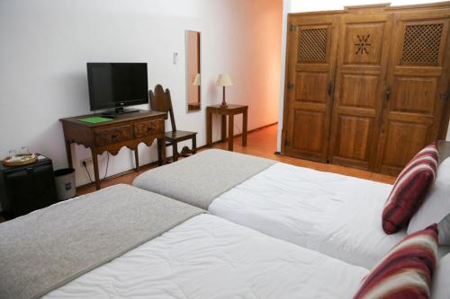 Postel nebo postele na pokoji v ubytování INATEL Castelo De Vide