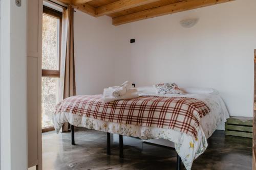 En eller flere senge i et værelse på Agriturismo Le Piagge