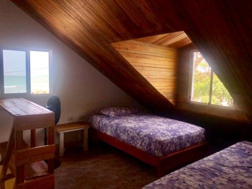 Postel nebo postele na pokoji v ubytování Hotel Santorini