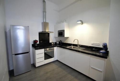 Cuisine ou kitchenette dans l'établissement MyFlats Belando