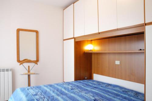 Postel nebo postele na pokoji v ubytování Appartamenti Acacie AdriaMare