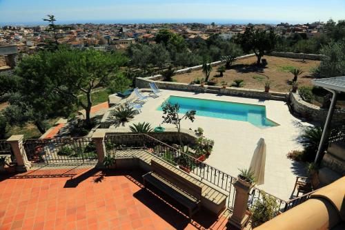 a view of a swimming pool from a house at Eremo delle Grazie in Ispica