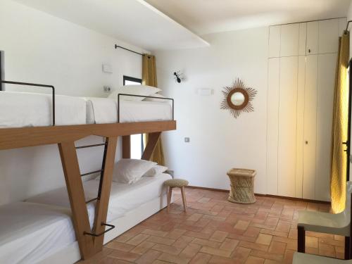 a bedroom with two bunk beds in a room at Casa del Capitan in Cadaqués