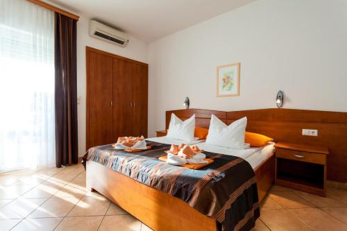 Postel nebo postele na pokoji v ubytování Guesthouse Villa Adria