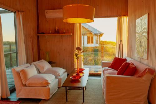 a living room with two couches and a table at BDL Beach Design loft Two in José Ignacio