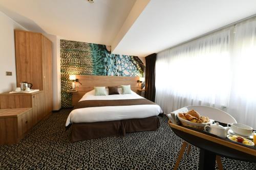 Postel nebo postele na pokoji v ubytování In Situ Hotel