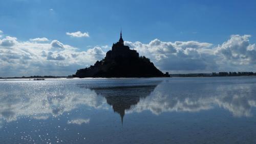 an island in the middle of a body of water at Gites Bijoux in Argouges