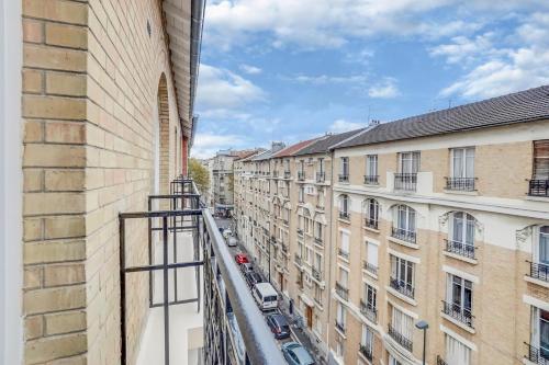a view from a balcony of buildings at Paris Hotel in Clichy