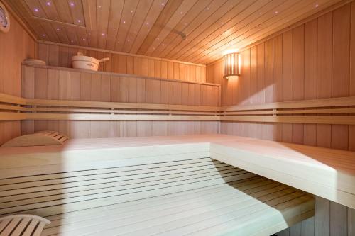 a sauna with a bed in the middle at Paris Hotel in Clichy
